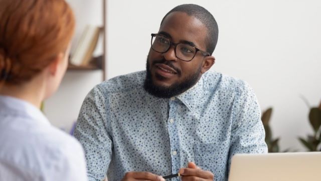 Manager intently listening to what employee is saying