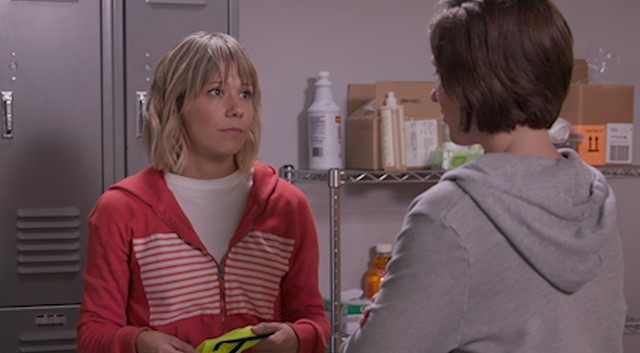 Two female coworkers talking