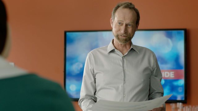Male manager is talking to a female employee