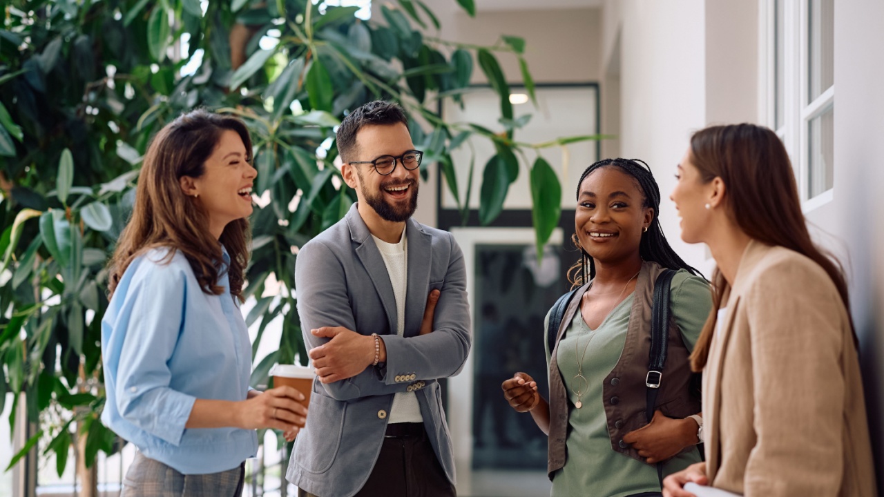 four employees having a positive discussion