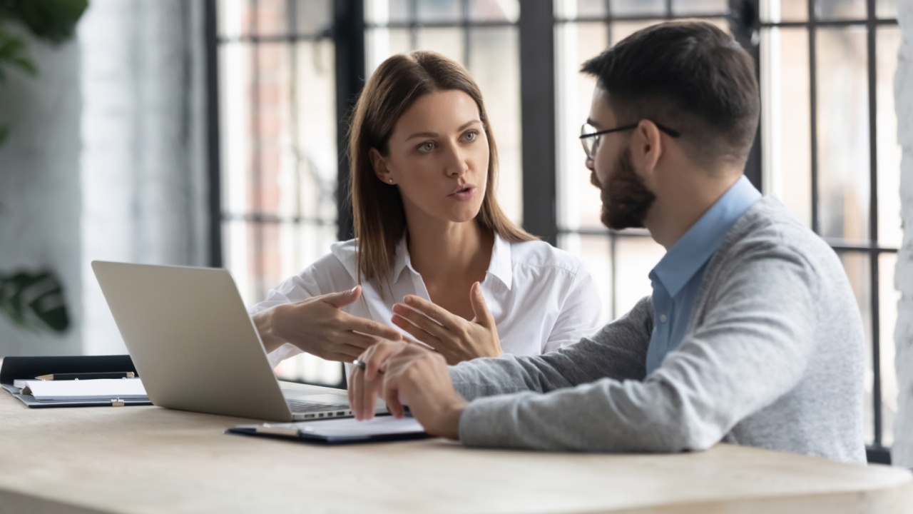 Female manage having discussion with male manager
