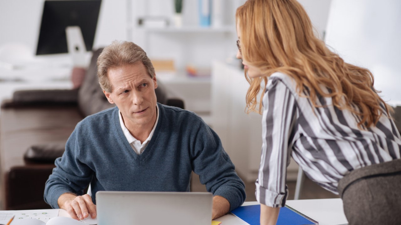 Male and female co-workers having a tense discussion