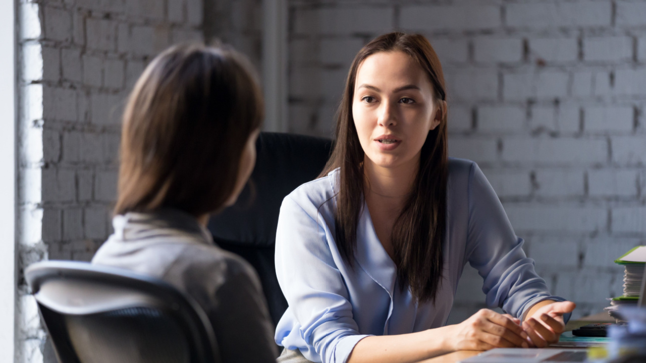 Manager and employee having serious conversation